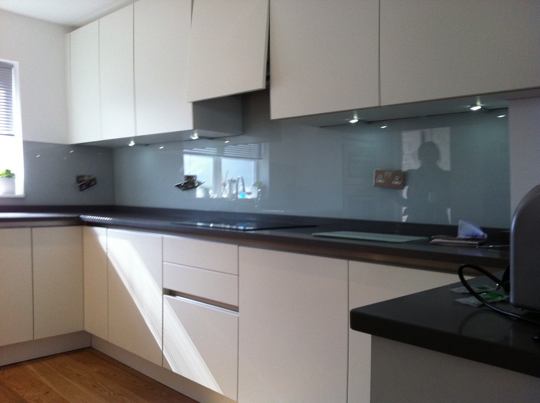 Grey glass kitchen splashback with LED lighting in Plumstead