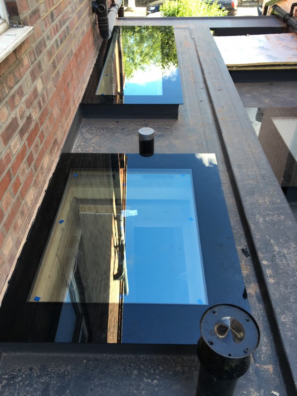 Multiple flat roof skylights on extension in Plumstead
